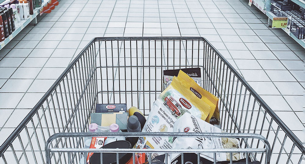 cart with products in grocery store