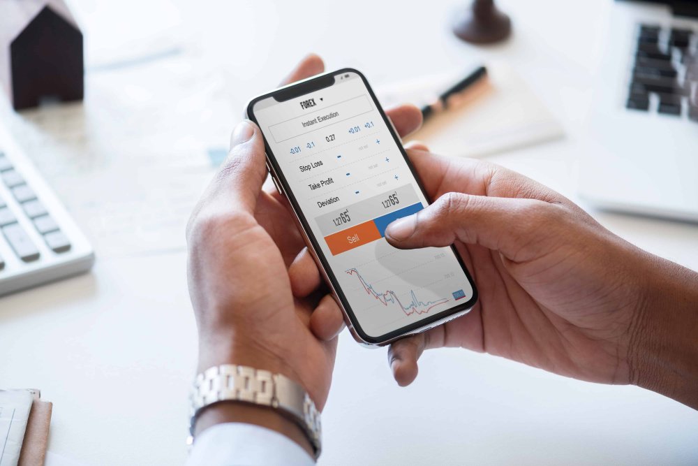 man on phone doing stock market trading