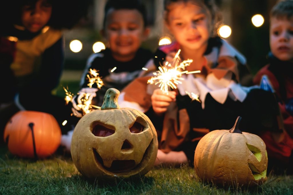 kids with sparklers celebrating halloween